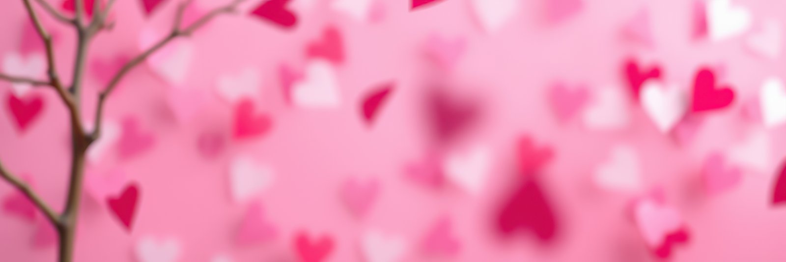 Valentine's Day decorations with hearts on a pink background creating a festive atmosphere